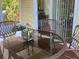 Cozy outdoor patio area with wicker furniture, perfect for relaxing or entertaining guests with natural light at 2808 Manatee Rd, Tavares, FL 32778
