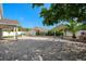 Beautifully landscaped backyard featuring a paver patio at 2830 Alton Dr, Kissimmee, FL 34741