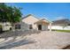 Paver patio, beautiful landscaping, and exterior view of a home's rear elevation at 2830 Alton Dr, Kissimmee, FL 34741