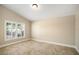 Bright bedroom with large window and plantation shutters, providing ample natural light at 2830 Alton Dr, Kissimmee, FL 34741