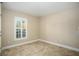 Bedroom featuring a shuttered window and neutral wall color at 2830 Alton Dr, Kissimmee, FL 34741