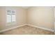 Bedroom with a shuttered window and neutral wall colors at 2830 Alton Dr, Kissimmee, FL 34741