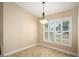 Dining room featuring plantation shutters and a modern chandelier for an elegant touch at 2830 Alton Dr, Kissimmee, FL 34741