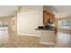Open concept kitchen featuring a breakfast bar and seamless transition to the living area at 2830 Alton Dr, Kissimmee, FL 34741