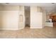 Open living space with a display niche and tile flooring leading to kitchen at 2830 Alton Dr, Kissimmee, FL 34741