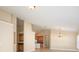 Open-concept living area with view of the kitchen and a high vaulted ceiling at 2830 Alton Dr, Kissimmee, FL 34741