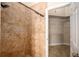 The tiled shower features mosaic accents and a showerhead on a slide bar at 2830 Alton Dr, Kissimmee, FL 34741