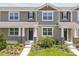 Charming townhome featuring a landscaped front yard, neutral siding, and a welcoming entrance with stone-accented columns at 3029 Douglas Fir Dr, Apopka, FL 32703
