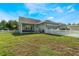 Beautiful home featuring a well-manicured lawn with a charming white picket fence at 3223 Blazing Star Ln, Harmony, FL 34773