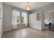A charming bedroom showcases a pull-down bed with built-in shelving and bright natural light from the large window at 3223 Blazing Star Ln, Harmony, FL 34773