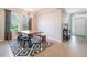 Bright dining room featuring stylish light fixture, geometric rug, and a bench for seating at 3223 Blazing Star Ln, Harmony, FL 34773