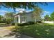 A beautiful house with lush landscaping, healthy green grass, and a well-maintained lawn at 3223 Blazing Star Ln, Harmony, FL 34773