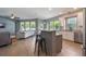 Open kitchen, bar area, dinette, and living room with lots of natural light at 3223 Blazing Star Ln, Harmony, FL 34773