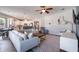Open-concept living room flowing into the kitchen and dining area, perfect for entertaining at 3223 Blazing Star Ln, Harmony, FL 34773