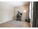 Functional home office space with a desk, ergonomic chair, natural light, and neutral decor at 3223 Blazing Star Ln, Harmony, FL 34773