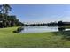 Picturesque lake view from the property, surrounded by lush greenery and mature trees for added privacy at 3225 Regal Crest Dr, Longwood, FL 32779