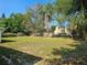 Large backyard with mature trees providing ample shade at 3516 Ridgemont Rd, Orlando, FL 32808