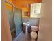 Functional bathroom with gray tiled shower and white vanity at 3516 Ridgemont Rd, Orlando, FL 32808