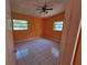 Cozy bedroom with tile flooring and a ceiling fan at 3516 Ridgemont Rd, Orlando, FL 32808