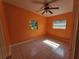 Comfortable bedroom with tile flooring and natural lighting at 3516 Ridgemont Rd, Orlando, FL 32808
