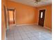 Spacious living room with tile floors and a ceiling fan at 3516 Ridgemont Rd, Orlando, FL 32808