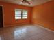 Bright living room with tile floors and natural light at 3516 Ridgemont Rd, Orlando, FL 32808