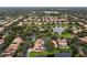 Picturesque aerial shot of a community with lake views, lush greenery, and well-maintained homes at 390 Anessa Rose Loop, Ocoee, FL 34761