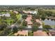 The community features homes surrounding a lake with a water fountain and mature trees at 390 Anessa Rose Loop, Ocoee, FL 34761