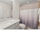 Clean bathroom with a shower featuring modern fixtures and a stylish vanity with marble countertop at 390 Anessa Rose Loop, Ocoee, FL 34761