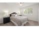 Inviting bedroom featuring a large window, neutral color scheme, and comfortable furnishings at 390 Anessa Rose Loop, Ocoee, FL 34761
