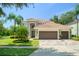 Beautiful two-story home featuring a three-car garage, tile roof, and well-maintained landscaping at 390 Anessa Rose Loop, Ocoee, FL 34761