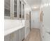 Hallway featuring custom built-in cabinets and drawers, and doors leading to other rooms at 390 Anessa Rose Loop, Ocoee, FL 34761