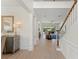 Welcoming hallway with staircase and elegant decor leading to the living room at 390 Anessa Rose Loop, Ocoee, FL 34761