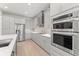 Modern kitchen with stainless steel appliances, granite countertops, and sleek cabinetry at 390 Anessa Rose Loop, Ocoee, FL 34761