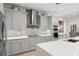 Well-equipped kitchen featuring stainless steel appliances, a modern cooktop, and ample counter space at 390 Anessa Rose Loop, Ocoee, FL 34761