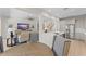 Open-concept living space with modern kitchen, stainless steel appliances, and stylish decor at 390 Anessa Rose Loop, Ocoee, FL 34761