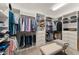 Custom walk-in closet with built-in shelving, drawers, and ample storage space for clothing and accessories at 390 Anessa Rose Loop, Ocoee, FL 34761
