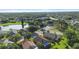 Residential neighborhood with homes surrounding lake at 4102 Boca Woods Dr, Orlando, FL 32826