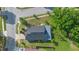 Aerial view of the property showcasing the house, roof, yard, landscaping, and neighborhood at 4102 Boca Woods Dr, Orlando, FL 32826