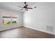 Bedroom with hardwood floors and a window showing the outdoors at 4102 Boca Woods Dr, Orlando, FL 32826