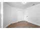Bedroom with hardwood floors, closet, and white trim at 4102 Boca Woods Dr, Orlando, FL 32826