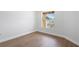 Cozy bedroom featuring hardwood floors and natural light at 4102 Boca Woods Dr, Orlando, FL 32826