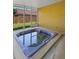 A close up view of the relaxing hot tub inside of a screened in patio at 4102 Boca Woods Dr, Orlando, FL 32826