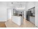 Modern kitchen features gray cabinets, granite countertops, stainless steel appliances, and an island at 4102 Boca Woods Dr, Orlando, FL 32826