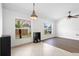 Living room with tile flooring, neutral walls, and natural light through the windows at 4102 Boca Woods Dr, Orlando, FL 32826