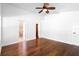 Spacious main bedroom showcasing wood floors, ensuite bathroom, and ample natural light at 4102 Boca Woods Dr, Orlando, FL 32826