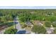 Street view of a well-maintained single-Gathering home with green lawn and mature trees at 4102 Boca Woods Dr, Orlando, FL 32826