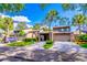 Attractive townhomes displaying well-manicured lawns, covered carports, and mature trees under a sunny sky at 458 Meadowood Blvd, Fern Park, FL 32730