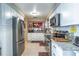 Updated kitchen featuring white cabinetry, granite countertops and stainless steel appliances at 458 Meadowood Blvd, Fern Park, FL 32730