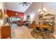 Open concept living room and dining area with carpet flooring and high ceilings at 458 Meadowood Blvd, Fern Park, FL 32730